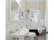 Bathroom with clawfoot tub and pedestal sink at 411 N Highland Ne Ave, Atlanta, GA 30307