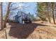 Expansive fenced backyard with mature trees, patio, and fire pit, perfect for outdoor gatherings and relaxation at 1878 Hamby Place Nw Dr, Acworth, GA 30102