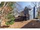 Exterior of home showing sloped backyard and wooden deck at 1878 Hamby Place Nw Dr, Acworth, GA 30102