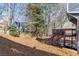 Large backyard with trees and a multi-level wooden deck at 1878 Hamby Place Nw Dr, Acworth, GA 30102