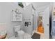 Bathroom featuring a toilet, shower with glass door, and a window for natural light at 1878 Hamby Place Nw Dr, Acworth, GA 30102