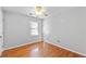 Bedroom with hardwood floors, a ceiling fan, and a window for natural light at 1878 Hamby Place Nw Dr, Acworth, GA 30102