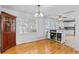 Dining room featuring wood floors, a traditional cabinet, and a serving buffet that connects to the kitchen at 1878 Hamby Place Nw Dr, Acworth, GA 30102