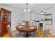 Dining room with hardwood floors, a round table with seating for four, and ample natural light from the windows at 1878 Hamby Place Nw Dr, Acworth, GA 30102