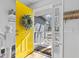 Bright entryway featuring a vibrant yellow door, stylish decor, and a welcoming atmosphere at 1878 Hamby Place Nw Dr, Acworth, GA 30102