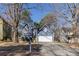 Inviting blue home with a yellow front door, set back on a spacious lot with mature trees at 1878 Hamby Place Nw Dr, Acworth, GA 30102