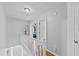 Upstairs hallway with white railing and access to bedrooms at 1878 Hamby Place Nw Dr, Acworth, GA 30102