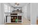 View of kitchen island with wine rack, storage shelves, and white cabinetry at 1878 Hamby Place Nw Dr, Acworth, GA 30102