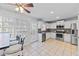 Bright kitchen featuring white cabinets, stainless steel appliances, tile backsplash, and tiled floors at 1878 Hamby Place Nw Dr, Acworth, GA 30102