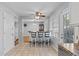 Open kitchen with an island, stainless steel appliances, bright white cabinets, and lots of windows at 1878 Hamby Place Nw Dr, Acworth, GA 30102