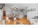 Open-concept living room with hardwood floors, neutral decor, and easy access to other living spaces at 1878 Hamby Place Nw Dr, Acworth, GA 30102
