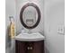 Cozy half-bath with stylish fixtures, a corner sink, and a decorative mirror at 1878 Hamby Place Nw Dr, Acworth, GA 30102