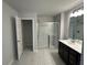 Bright bathroom with a glass-enclosed shower, single vanity, and closet at 214 Depot Landing Rd # 62, Auburn, GA 30011