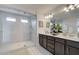 Double vanity bathroom with a large walk in shower at 214 Depot Landing Rd # 62, Auburn, GA 30011