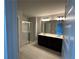 Modern bathroom with a double vanity, enclosed glass shower, and tiled floors at 214 Depot Landing Rd # 62, Auburn, GA 30011