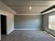 Bedroom boasting a tray ceiling, modern accent wall, and plush carpet at 214 Depot Landing Rd # 62, Auburn, GA 30011