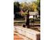 Wooden Bigfoot statue with American flag, near homes and trees at 214 Depot Landing Rd # 62, Auburn, GA 30011