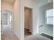 Hallway with carpet, linen closet and stairs at 214 Depot Landing Rd # 62, Auburn, GA 30011