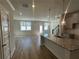 Bright kitchen with a center island, granite countertops, and wood flooring at 214 Depot Landing Rd # 62, Auburn, GA 30011