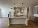 Open kitchen with granite countertops, shaker cabinets, and stainless steel appliances at 214 Depot Landing Rd # 62, Auburn, GA 30011
