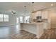 Modern kitchen with white cabinets, granite counters, and island at 214 Depot Landing Rd # 62, Auburn, GA 30011