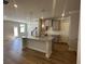 Modern kitchen with granite counters, center island and stainless steel appliances at 214 Depot Landing Rd # 62, Auburn, GA 30011