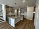 Open kitchen with granite countertops, shaker-style cabinets, and stainless steel appliances at 214 Depot Landing Rd # 62, Auburn, GA 30011
