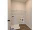 Laundry room with shelving and drain at 214 Depot Landing Rd # 62, Auburn, GA 30011
