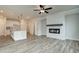 Spacious living room with hardwood floors and white brick fireplace at 214 Depot Landing Rd # 62, Auburn, GA 30011