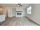 Living room with hardwood floors and a white brick fireplace at 214 Depot Landing Rd # 62, Auburn, GA 30011