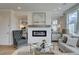 Relaxing living room with fireplace and ample natural light at 214 Depot Landing Rd # 62, Auburn, GA 30011