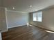 Bright, open-concept living room with wood flooring and natural light at 214 Depot Landing Rd # 62, Auburn, GA 30011