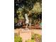 Bronze statue of a girl in a park playground at 214 Depot Landing Rd # 62, Auburn, GA 30011