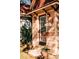 Charming peach-colored shop with hanging plants and a sign at 214 Depot Landing Rd # 62, Auburn, GA 30011
