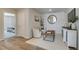 Upstairs sitting area with two armchairs and a large mirror at 214 Depot Landing Rd # 62, Auburn, GA 30011