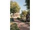 Brick pathway leading to a gazebo and water wheel at 214 Depot Landing Rd # 62, Auburn, GA 30011