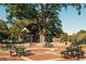 Quaint town square with brick pavers, picnic tables, and lush landscaping at 214 Depot Landing Rd # 62, Auburn, GA 30011