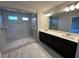 Bathroom with a glass-enclosed shower, double vanity, and contemporary lighting fixtures at 216 Depot Landing Rd # 61, Auburn, GA 30011