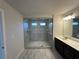 Bathroom featuring a glass-enclosed shower, double vanity, and modern fixtures at 216 Depot Landing Rd # 61, Auburn, GA 30011