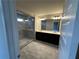 Bathroom with walk-in shower, double vanity, and modern fixtures at 216 Depot Landing Rd # 61, Auburn, GA 30011