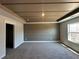 Inviting bedroom showcasing a trey ceiling, accent wall, cozy carpet, and a bright window at 216 Depot Landing Rd # 61, Auburn, GA 30011