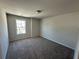 Cozy bedroom with plush carpeting, a window, and ample natural light at 216 Depot Landing Rd # 61, Auburn, GA 30011