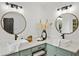 Double vanity bathroom with updated fixtures, large mirrors, and a light green vanity at 425 Shepard Sw Dr, Marietta, GA 30064