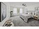 Spacious main bedroom with gray carpet, ceiling fan, and plenty of natural light at 425 Shepard Sw Dr, Marietta, GA 30064