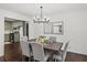 Elegant dining room features a dark wood table and a view into the kitchen at 425 Shepard Sw Dr, Marietta, GA 30064