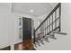 Spacious entryway with dark hardwood floors and a staircase with metal railing at 425 Shepard Sw Dr, Marietta, GA 30064