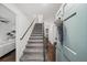 Bright entryway with gray carpeting on the staircase and dark hardwood floors at 425 Shepard Sw Dr, Marietta, GA 30064