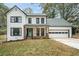 Two-story white farmhouse with black trim, gray roof, and a charming front porch at 425 Shepard Sw Dr, Marietta, GA 30064