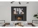 Living room with a cozy brick fireplace and modern artwork above at 425 Shepard Sw Dr, Marietta, GA 30064