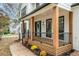 Inviting front porch with wooden posts, black railing, and a light teal door at 425 Shepard Sw Dr, Marietta, GA 30064
